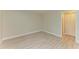 Bright bedroom with wood-look tile flooring and large closet at 7022 W Country Club N Dr # 132, Sarasota, FL 34243