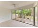 Enclosed patio with sliding glass doors and view of backyard at 7022 W Country Club N Dr # 132, Sarasota, FL 34243