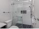 Clean bathroom with a large glass shower and hexagon tile flooring at 703 Ironwood Dr # 114, Venice, FL 34292