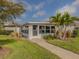 Community room with screened windows and walkway at 703 Ironwood Dr # 114, Venice, FL 34292