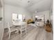 Dining area with a round table and chairs, overlooking a patio at 703 Ironwood Dr # 114, Venice, FL 34292