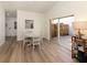 Bright dining area with a round table and chairs near the kitchen at 703 Ironwood Dr # 114, Venice, FL 34292