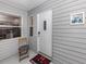 Inviting front entry with white door and Halloween mat at 703 Ironwood Dr # 114, Venice, FL 34292
