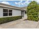 Home exterior featuring walkway and landscaping at 703 Ironwood Dr # 114, Venice, FL 34292