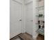 Clean hallway with two white doors and glass shelves at 703 Ironwood Dr # 114, Venice, FL 34292