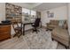 Home office with a desk, couch, and built-in bookcase at 703 Ironwood Dr # 114, Venice, FL 34292