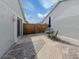 Spacious patio with seating area and wooden gate at 703 Ironwood Dr # 114, Venice, FL 34292