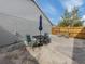 Private patio with table, chairs, and umbrella at 703 Ironwood Dr # 114, Venice, FL 34292