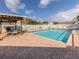 Community pool with pergola, tables and chairs at 703 Ironwood Dr # 114, Venice, FL 34292