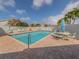 Community pool with surrounding patio furniture at 703 Ironwood Dr # 114, Venice, FL 34292