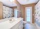 Bathroom featuring a white vanity with a sink, toilet, and shower at 7321 Teaberry St, Englewood, FL 34224