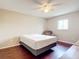Bright bedroom with wood flooring, a ceiling fan, and a window offering ample natural light at 7321 Teaberry St, Englewood, FL 34224