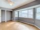 Bedroom with hardwood floors, bay windows, and a ceiling fan at 7321 Teaberry St, Englewood, FL 34224