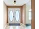 Inviting foyer featuring a stylish double door entry and neutral walls at 7321 Teaberry St, Englewood, FL 34224