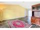Bright living room with vaulted ceilings, tile flooring, and a view of the backyard at 7321 Teaberry St, Englewood, FL 34224