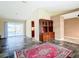 Open concept living room with tile flooring and sliding glass doors to the pool area at 7321 Teaberry St, Englewood, FL 34224