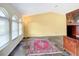 Bright living room with large windows, vaulted ceilings, and tile flooring at 7321 Teaberry St, Englewood, FL 34224
