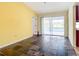 Bright living room with tile flooring and sliding glass doors to the outdoor pool at 7321 Teaberry St, Englewood, FL 34224