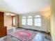 Spacious living room with tile flooring, large windows, and plenty of natural light at 7321 Teaberry St, Englewood, FL 34224
