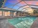 Enclosed backyard pool with a screened-in lanai, providing a private outdoor space at 7321 Teaberry St, Englewood, FL 34224