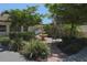 Relaxing courtyard with fountain, landscaping, and seating at 801 Waterside Dr # 102, Venice, FL 34285