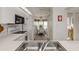 Bright kitchen offering white appliances and cabinetry, as well as an eat-in breakfast nook at 801 Waterside Dr # 102, Venice, FL 34285