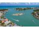 Aerial view of waterfront homes and boats on calm water at 826 Bayport Cir, Venice, FL 34292