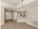 Bright kitchen features white cabinets, laminate flooring, and a breakfast bar at 826 Bayport Cir, Venice, FL 34292