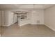 Bright kitchen features white cabinets, laminate flooring, and a breakfast bar at 826 Bayport Cir, Venice, FL 34292