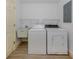 Laundry room with washer, dryer, and utility sink at 826 Bayport Cir, Venice, FL 34292