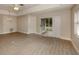 Spacious living room with vinyl plank flooring and sliding glass doors to patio at 826 Bayport Cir, Venice, FL 34292