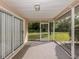 Screened porch with sliding glass doors at 826 Bayport Cir, Venice, FL 34292