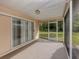 Screened porch with sliding glass doors at 826 Bayport Cir, Venice, FL 34292