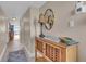 Bright condo entry with wood cabinet and mirror at 840 The Esplanade N # 703, Venice, FL 34285