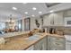Kitchen boasts granite counters, white cabinets, and breakfast bar at 840 The Esplanade N # 703, Venice, FL 34285