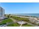 Stunning ocean view from beachfront property with lush landscaping at 840 The Esplanade N # 703, Venice, FL 34285