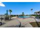 Inviting community pool with patio seating at 840 The Esplanade N # 703, Venice, FL 34285