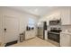 Modern kitchen with stainless steel appliances and white cabinets at 8545 Daybreak St, Sarasota, FL 34241