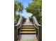 Beach access walkway with steps leading to sandy beach at 9824 Haze Dr, Venice, FL 34292