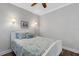 Bright bedroom with a queen-size bed and coastal decor at 9824 Haze Dr, Venice, FL 34292