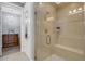 Modern shower with glass enclosure and built-in seat at 9824 Haze Dr, Venice, FL 34292