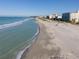Aerial view of beach, ocean, and shoreline buildings at 1035 Beckley Cir, Venice, FL 34292