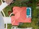 Bird's-eye view of a house with a pool and lush landscaping at 1035 Beckley Cir, Venice, FL 34292