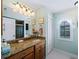 Bathroom with granite countertop and walk-in shower at 1035 Beckley Cir, Venice, FL 34292