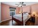 Guest bedroom with wood floors and post bed at 1035 Beckley Cir, Venice, FL 34292
