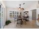 Bright breakfast nook with table and chairs near pool at 1035 Beckley Cir, Venice, FL 34292