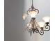 Elegant chandelier with five lights illuminating a room at 1035 Beckley Cir, Venice, FL 34292