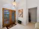 Bright and spacious entryway with double wood doors at 1035 Beckley Cir, Venice, FL 34292