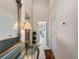 Inviting entryway with mirror and access to kitchen and laundry at 1035 Beckley Cir, Venice, FL 34292