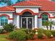 Ornate double front doors with sidelights and decorative screen at 1035 Beckley Cir, Venice, FL 34292